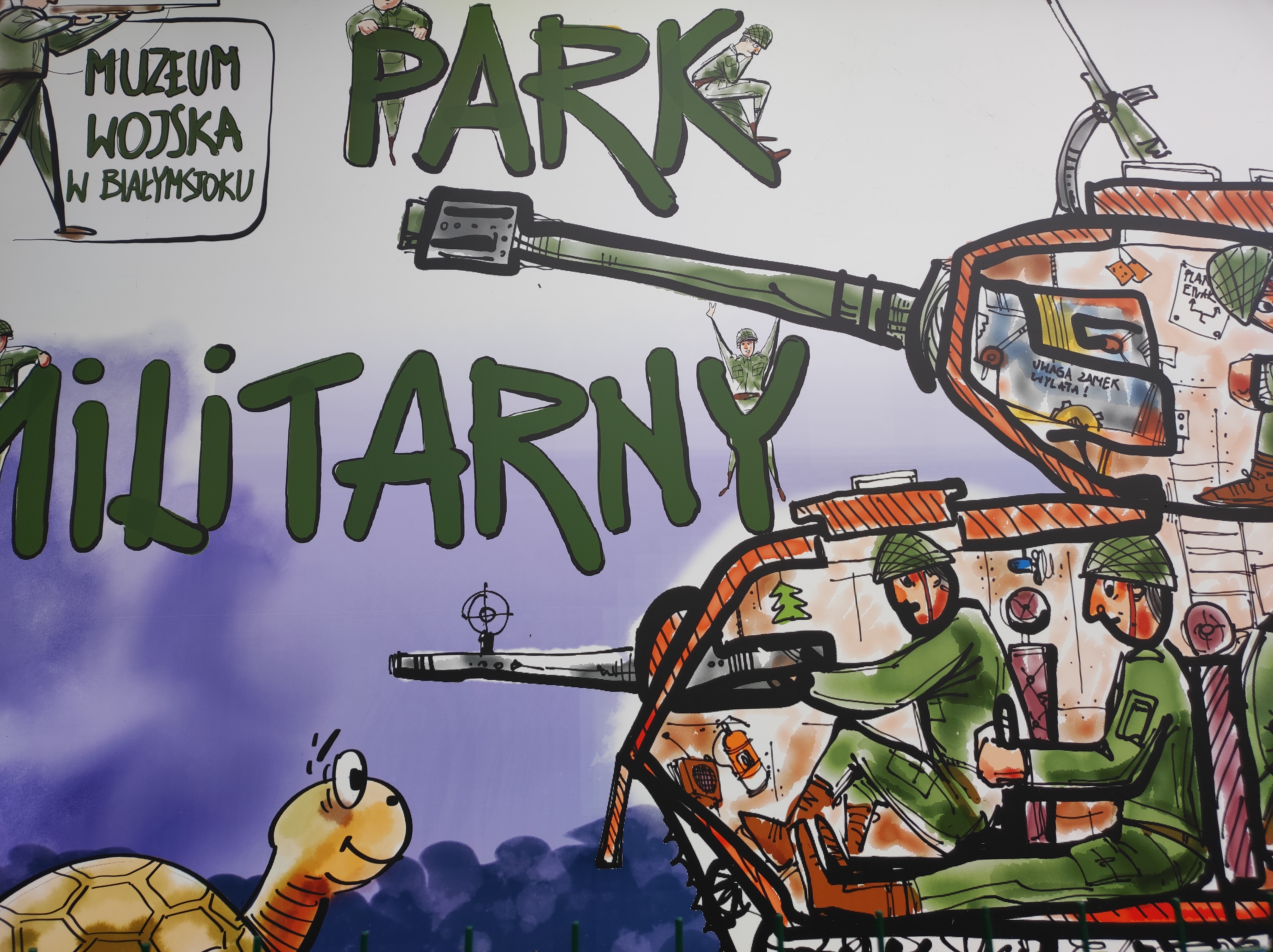 Grafitti na ścianie, żołnierze siedzą w czołgu, obok przechadza się żółw